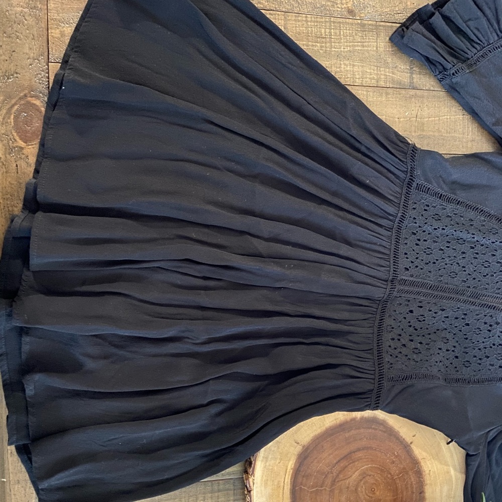 the flowers on the top are holes but it can be worn with something under.